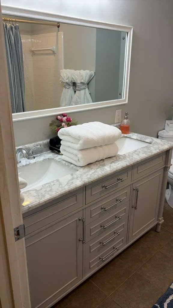 Bathroom vanity closeup with fresh towels