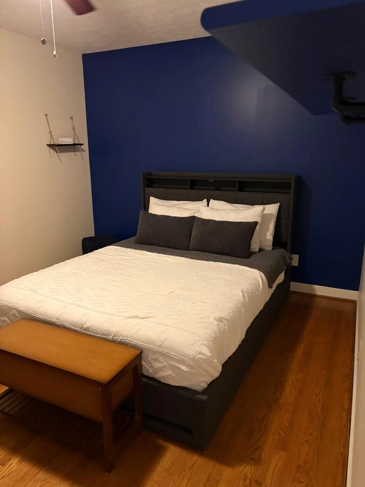 Bedroom with blue accent wall