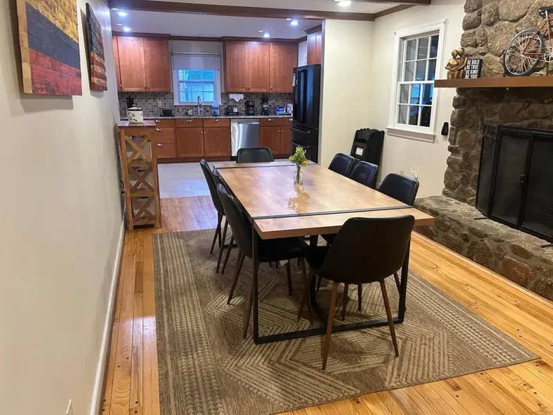 Open kitchen and dining area at the Liberty Ranch House with a table that seats fourteen