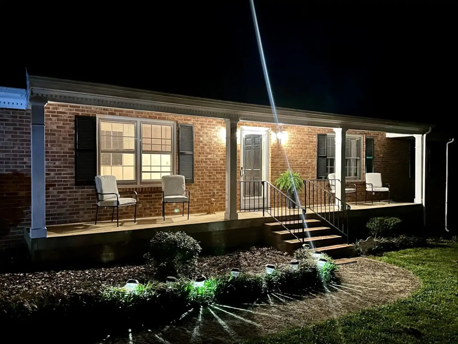 Front porch lit up at night